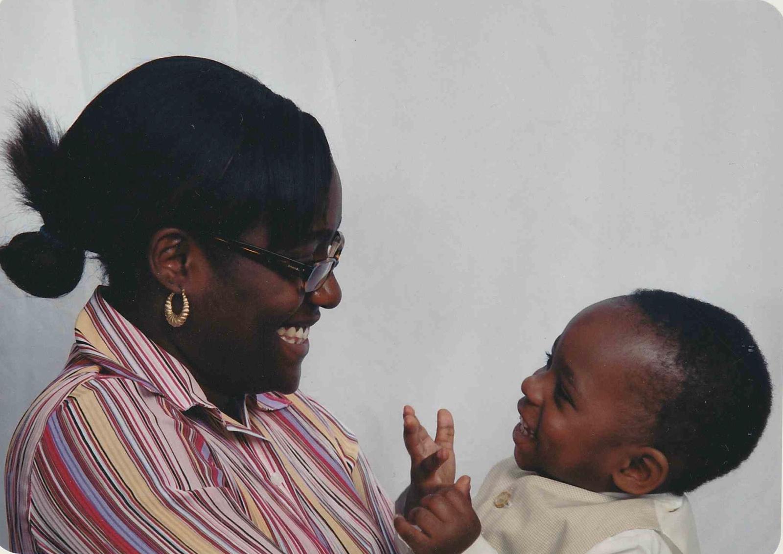 A mother and her son laughing together in conversation. From homegrownthinking.com